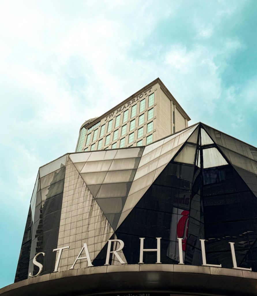 Striking architectural design of the Starhill building in vibrant daylight.